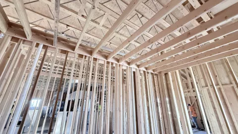Interior timber framed walls with exposed ceiling joists.