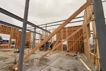 Interior wood framing with diagonal bracing at AFCU Rexburg, integrated with the structural steel frame