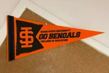 Orange "Go Bengals — Idaho State University College of Education" pennant pinned to a corkboard inside Albion Hall