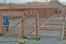 Tall wall framing with parapet and interior partition walls under construction at IDOC Re-entry Center