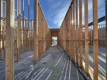 BLU-D Framing hallway perspective view of wood stud framing at Alpine Academy