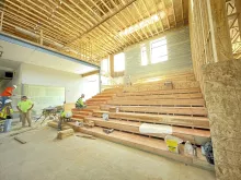 BLU-D Framing interior view of stadium seating installation in Alpine Academy