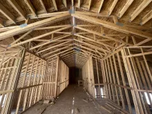 BLU-D framing fully sheathed roof and exterior walls viewed from inside of Hibbard Elementary