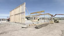 Single timber framed exterior wall with installed glulam beams.