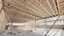 Partial interior timber framing with exposed ceiling joists.