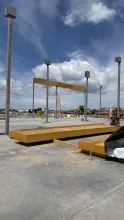 Single Glulam beam set on supportive structural metal posts.