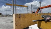 Large Glulam beam waiting to be set.
