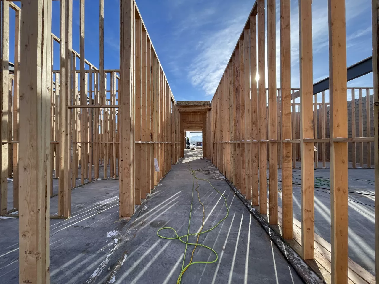 BLU-D Framing hallway perspective view of wood stud framing at Alpine Academy