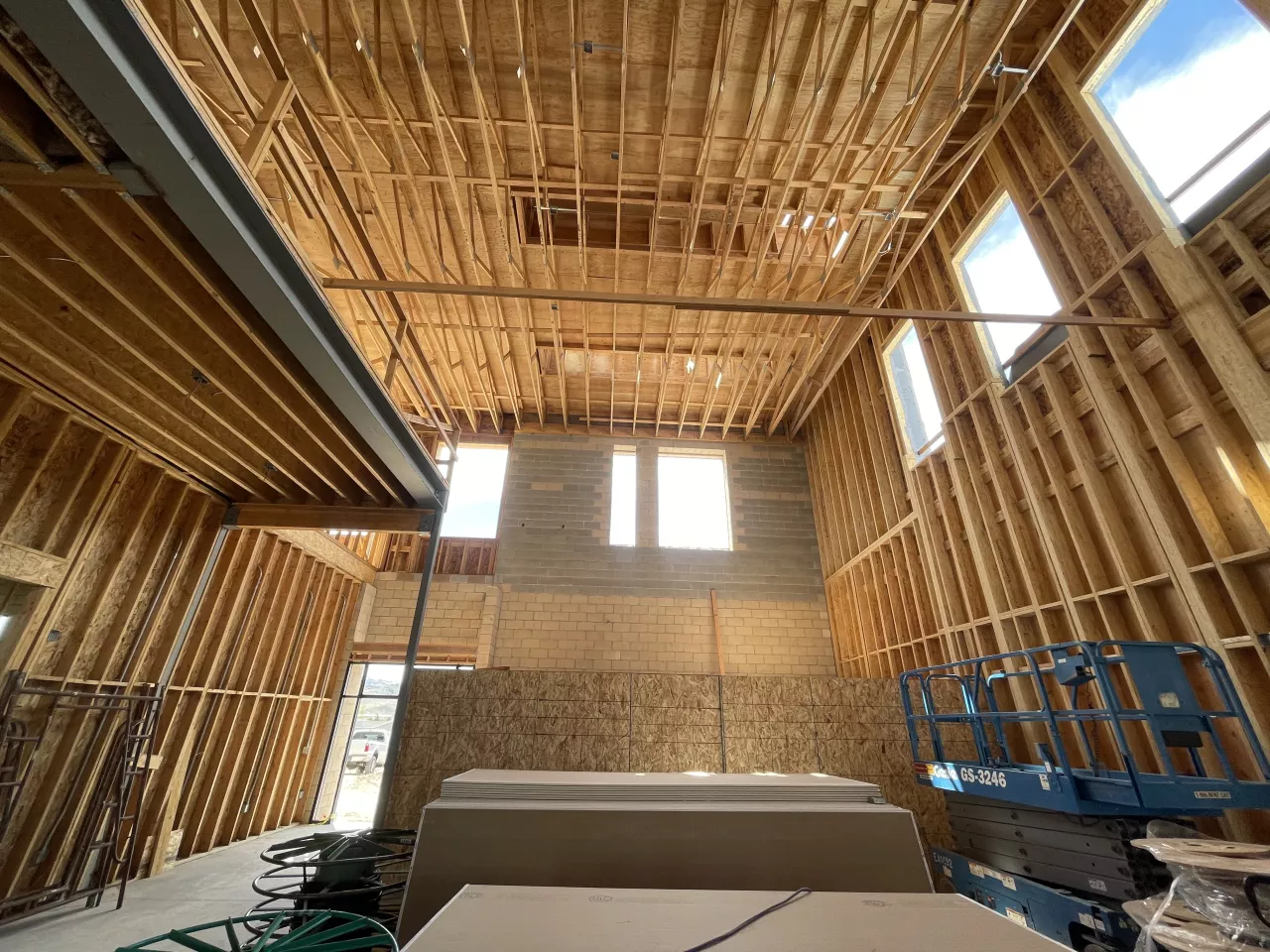 BLU-D Framing Interior view of fully framed and sheathed 2 story lobby in Alpine Academy