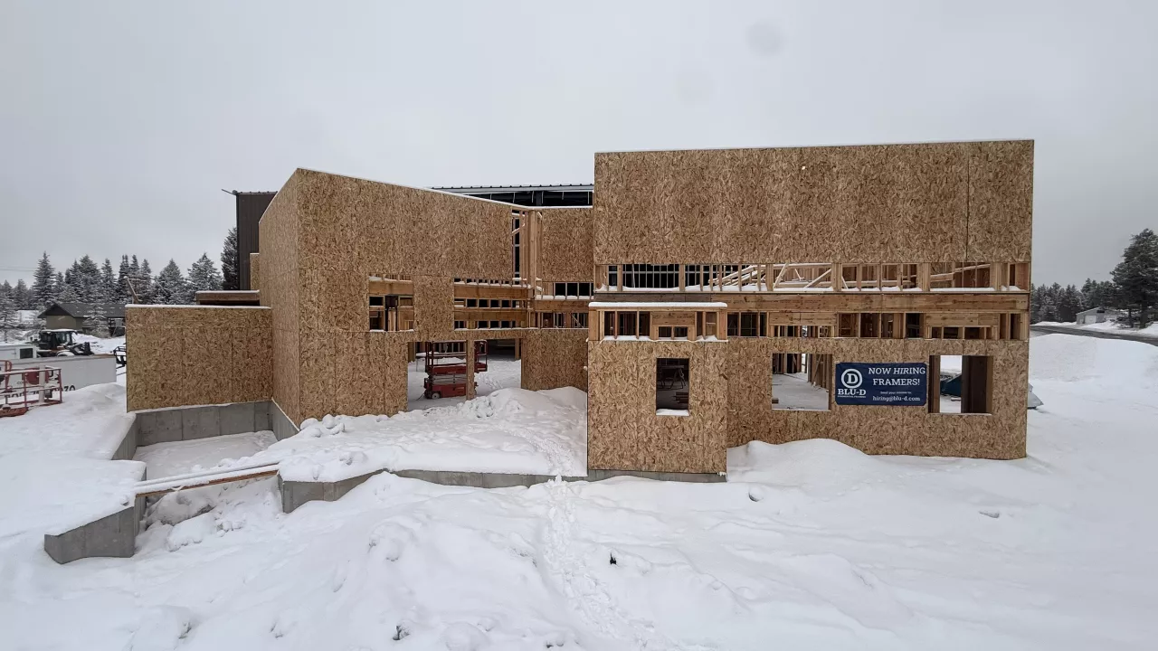 Playmill Theater's framed front buildings, sheathed in OSB, in deep snow